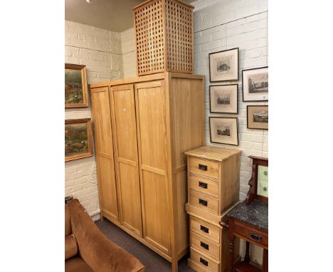 Contemporary light oak three door wardrobe, 200cm by 150cm by 57cm, pair three drawer pedestal chests and lattice work laundr