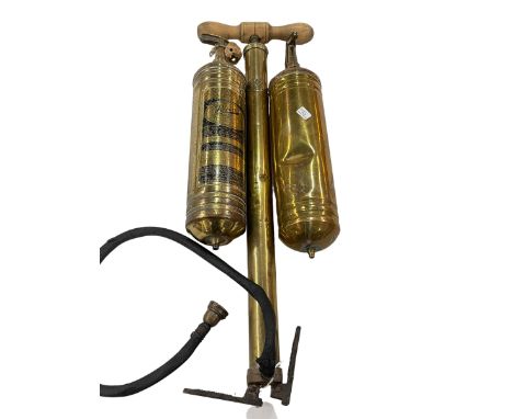 Two vintage fire extinguishers and a brass garden spray.