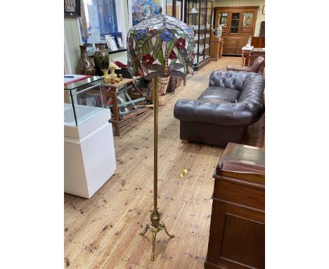 Brass triform floor lamp with Tiffany style shade.