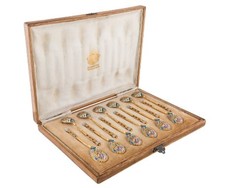 A SET OF TWELVE RUSSIAN SILVER GILT AND CLOISONNE ENAMEL COFFEE SPOONS, 11TH ARTEL, MOSCOW, 1908-1917the ovoid bowls decorate