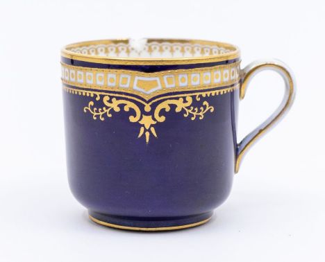 An early 20th Century Spode coffee cup, cobalt blue ground with gilt upper section decoration, the underside with green facto