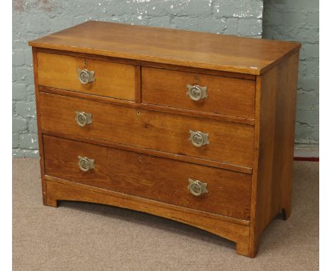 An oak two over two chest of drawers.