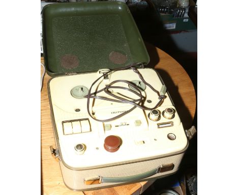 A vintage vinyl covered Telefunken reel to reel tape recorder made in Western Germany 220 volt, plug removed.