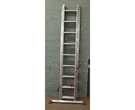 An alluminium triple ladder.