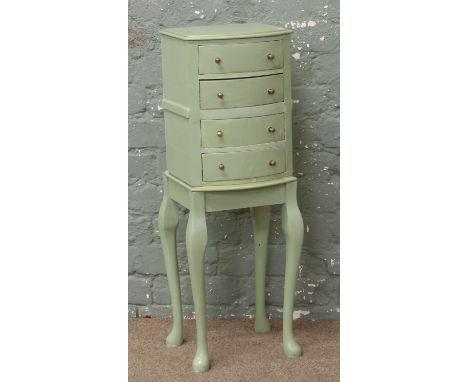 A painted four high chest of drawers raised on cabriole supports.