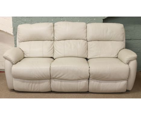 A cream leather reclining three seat sofa.