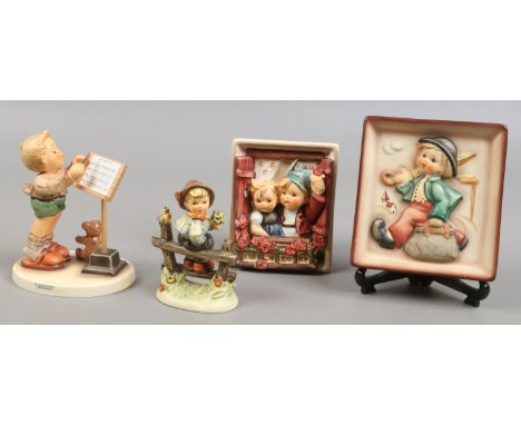 Two Goebel figures of boys along with two Goebel plaques.