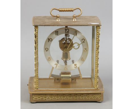 A brass and glass Kieninger & Obergfell electro magnetic mantel clock.