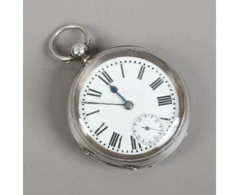 A silver cased pocket watch with Swiss movement white enamel dial and second subsidiary dial.