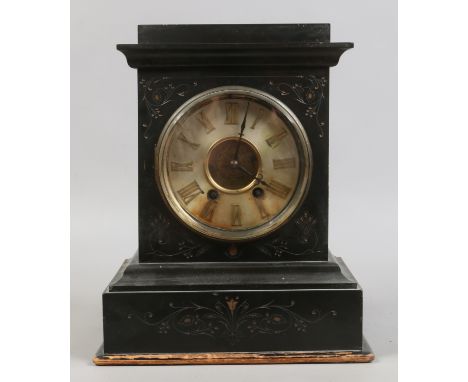 A Victorian slate mantel clock with 8 day movement brass dial and Roman numeral baton markers.