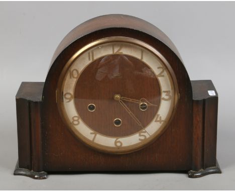 An oak cased Smiths Enfield Westminster chime mantle clock with pendulum and key.