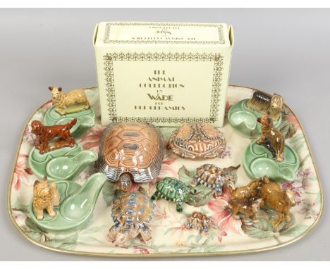 A collection of Wade ceramics including pipe stands, tortoise figurines and the animal collection 'The British Lion etc.