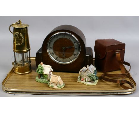 An oak mantle clock, a cased Kodak camera, Ellies safety lamp and two Lilliput Lane cottages along with another.