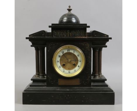 A Victorian slate mantle clock with French 8 day movement, brass and enamel dial chiming on a coiled gong and bearing later p