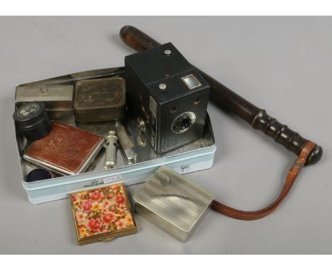 A box of collectables including popular Brownie box camera, truncheon, old pen knife, Metropolitan whistle, old tins, yellow 