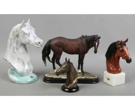 A quantity of Equine collectables including three busts along with a composite model of a bay horse.