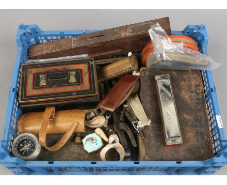 A box of mixed collectables to include clay pipes, thimbles, 19th century prayer book, Hohner harmonica etc.