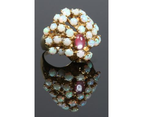 A high carat gold abstract modern opal and cabachon Chrysoberyl cluster ring, size W.