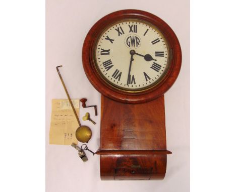 GWR drop dial wall clock, white enamel dial with Roman numerals to include key and pendulum, an original GWR whistle and docu