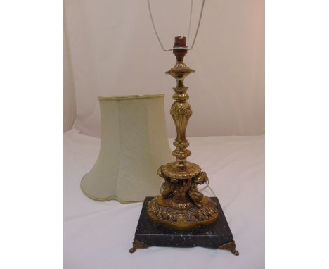 A gilt metal table lamp of scroll chased baluster form on square marble base to include silk shade, 47cm (h)