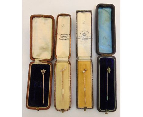 Four cased stick pins of various style and form