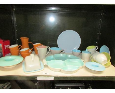 A shelf of Poole pottery