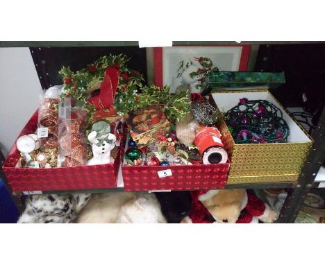 A shelf of assorted Christmas decorations