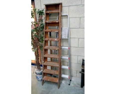A wooden step ladder and an aluminium step ladder
