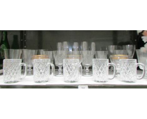 A shelf of drinking glasses