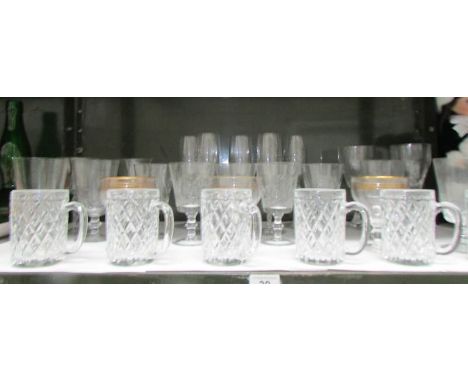 A shelf of drinking glasses