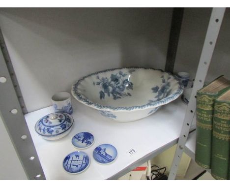 A large blue and white wash basin and other blue and white china