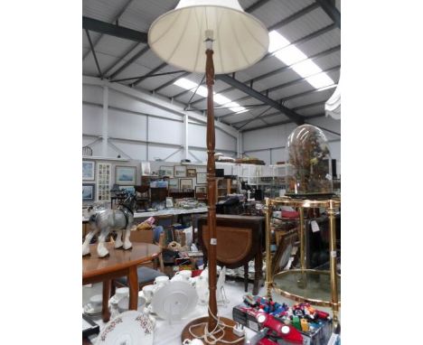 A standard lamp with shade