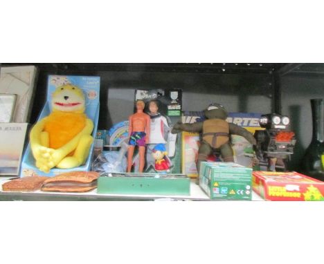 A shelf of assorted toys including Robot