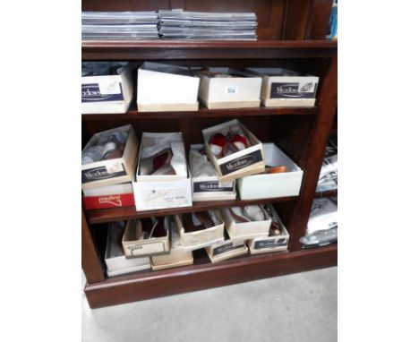 A large collection of boxed vintage 70/80's shoes and sandals in various sizes and designs (never worn)