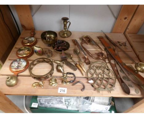 A mixed lot of brass ware, one shelf