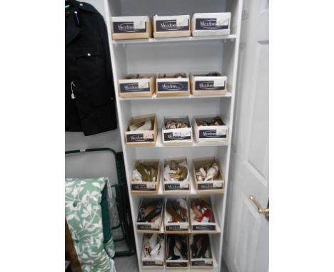 A large collection of boxed vintage 70/80's shoes and sandals in various sizes and designs (never worn)