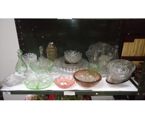 A shelf of mixed glass ware