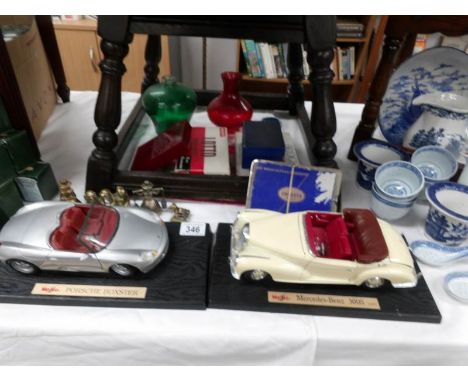 2 model cars, playing cards, brass animals etc
