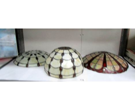 A matching Tiffany style ceiling lamp shade and table lamp shade together with one other ceiling shade