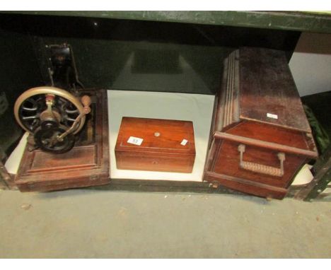 A vintage sewing machine and a small mahogany box