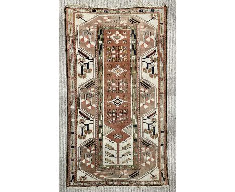 EASTERN WOOLLEN RUG with multicoloured and multibordered diamond and arrow pattern throughout, 192 x 109cms