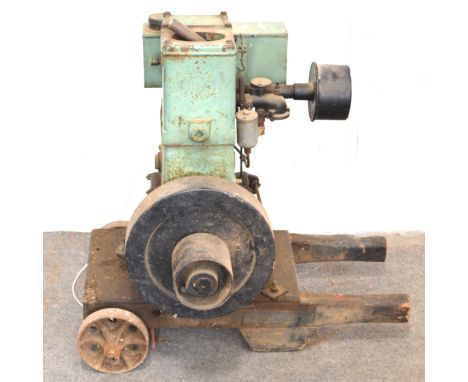 Lister D type stationary engine, 1/5HP, No. 1/35766, Spec. 28DH, RPM 700, as found, mounted on a wooden wheel carriage.