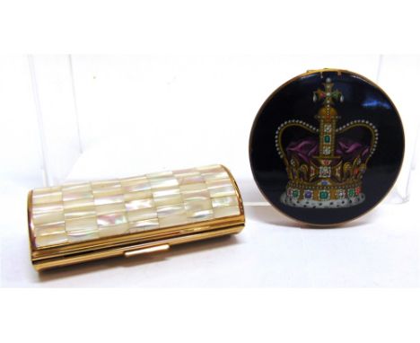 A MUSICAL POWDER COMPACT of cylindrical form, decorated with mother of pearl, 8.8cm long; with a circular powder compact with
