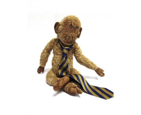 A MERRYTHOUGHT GRAN'POP SOFT TOY MONKEY  after the character created by Lawson Wood, labelled to left foot, 42cm long.