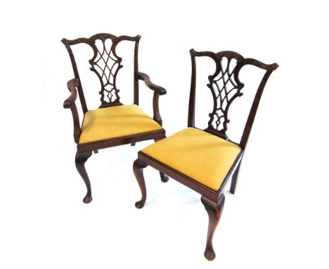 A SET OF EIGHT CARVED MAHOGANY DINING CHAIRS  in Chippendale style, including a pair of carvers, with 'Warings' labels