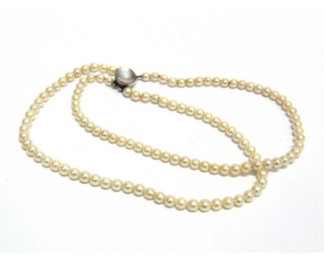 A TWO ROW CULTURED PEARL NECKLACE  the sixty-one and fifty-seven pearls of approximately 5.8mm diameter.