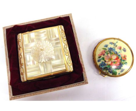 A POWDER COMPACT  the cover applied with a peacock in splendour, box; and another compact 