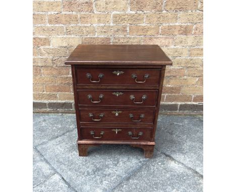 A SMALL MAHOGANY FOUR DRAWER CHEST  on bracket feet, 52cm wide 39cm deep 64cm high