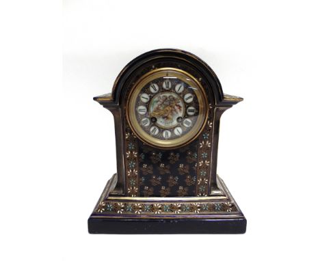 AN 8-DAY CONTINENTAL MANTLE CLOCK  in blue ceramic case heightened in gilt, the circular dial decorated with cherubs and insc