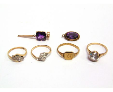 AN AMETHYST PENDANT  with a knife edge suspension below; an amethyst pendant; a 9 carat gold signet ring; a 9 carat gold colo